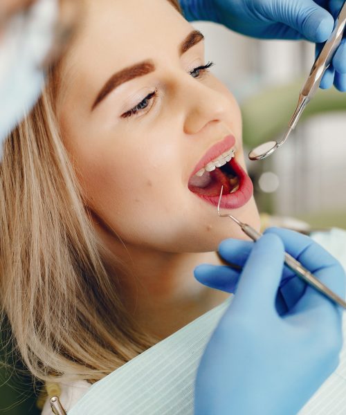 Beautiful lady in the dentist's office. Woman in a uniform